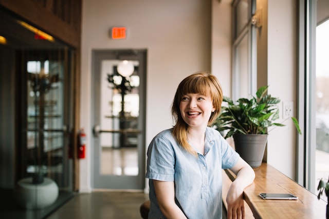 Woman smiling by window